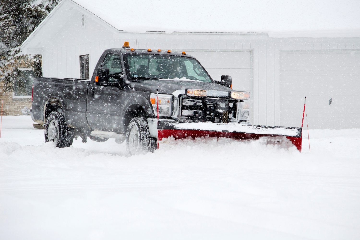 A,Worker,Plows,Heavy,White,Snow,During,A,Michigan,Winter a worker plows heavy white snow during a Hamilton winter